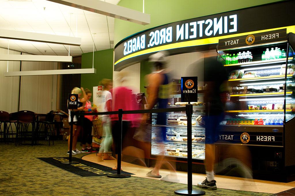 Students wait in line at Einstein Bros. Bagels in Pius XII Memorial Library