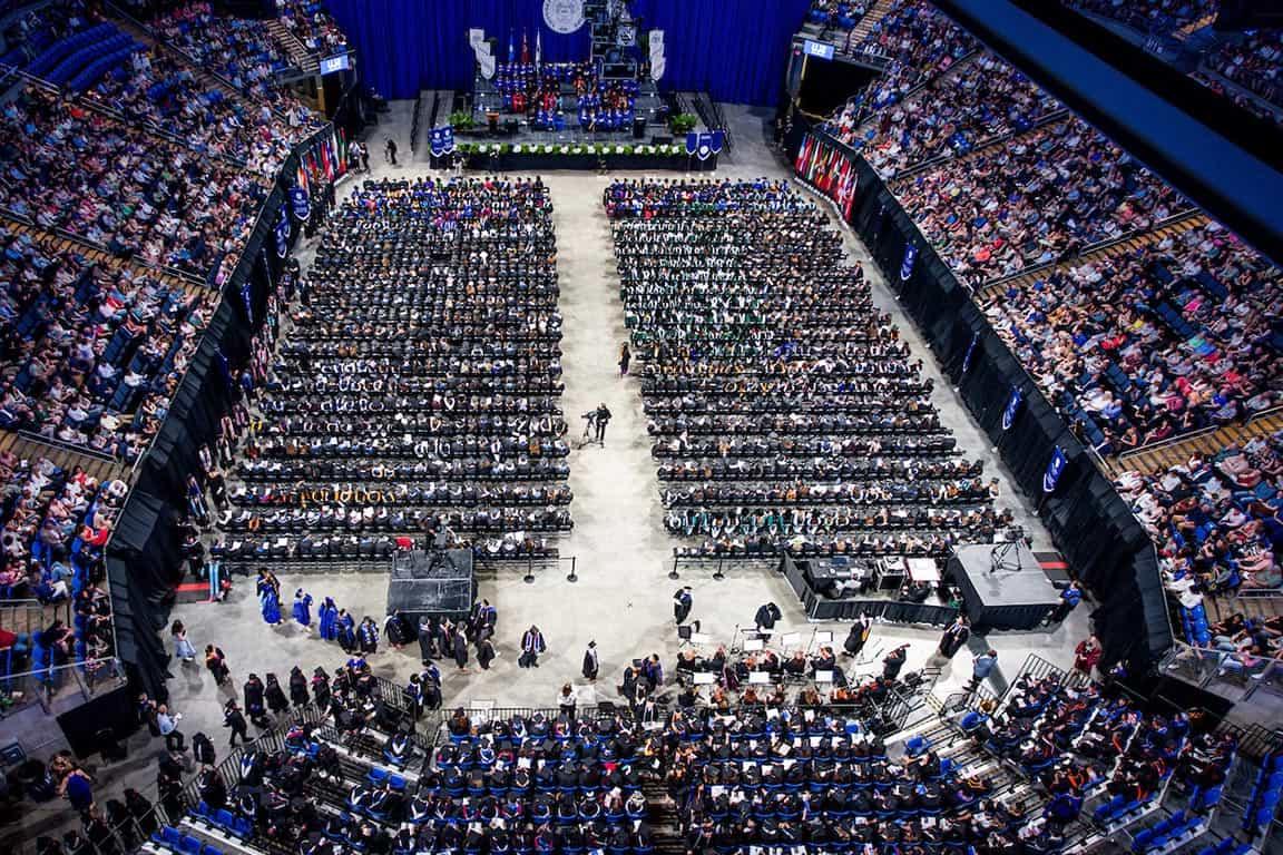A birds-eye view of the Chaifetz Arena full of graduates and guests during the 2024 commencement.